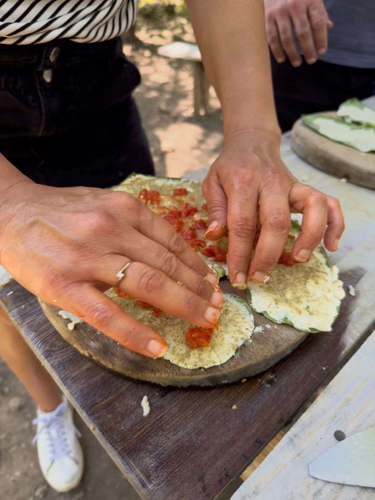 Preparing tortillas by hand during a Maya cooking experience